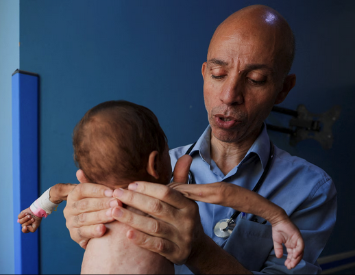 Healthcare workers treating patients in clinic
